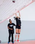 Be a setter in volleyball who knows how to run an effective offensive attack with two or three front row hitters to beat the block and opposing defense. 