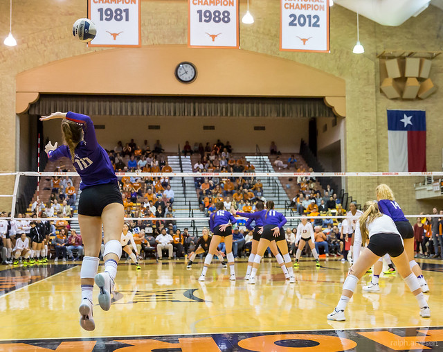TCU Horns jumpserver in flight behind her defense