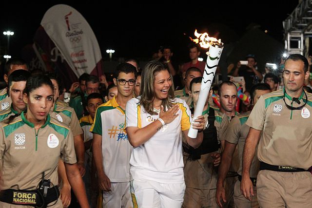 Brazilian volleyball Olympian Leila Barries carries Olympic Torch in Rio