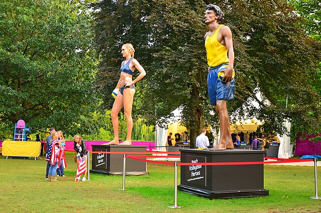 Statues of Kerri Walsh and Emanuel Rego outside the Beach volleyball Horse Guards Parade stadium at the 2012 Summer Olympics.