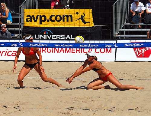 With a ball coming hard and fast between two beach passers, the teammates have to communicate quickly to decide who is going to move to pass that deep ball. (Steve Corey)