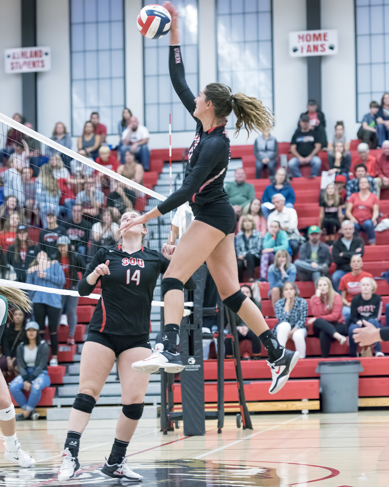 Outside and middle hitters should learn to reach high to hit the ball, contacting it at its highest height and looking to hit high off the blockers hands. (Al Case)