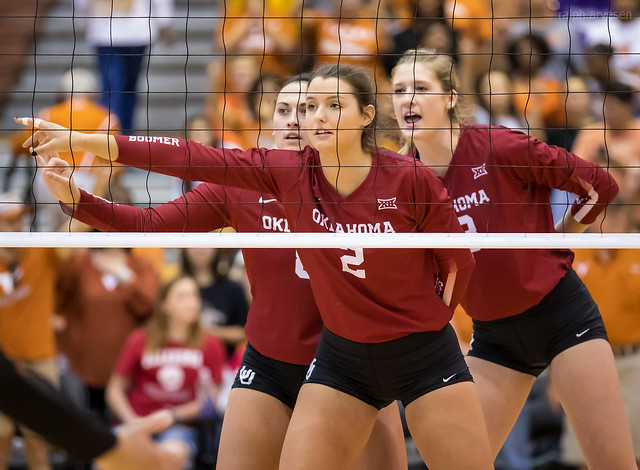 The blockers in their ready volleyball position should always be looking at the opposing team's setter, the ball she sets and the available hitters across the net. (Aversen)