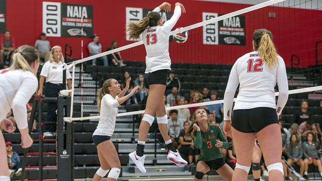 What is blocking in volleyball? when the serving team's on defense with 3 front row blockers who try to stop opposing hitters from hitting into their court.