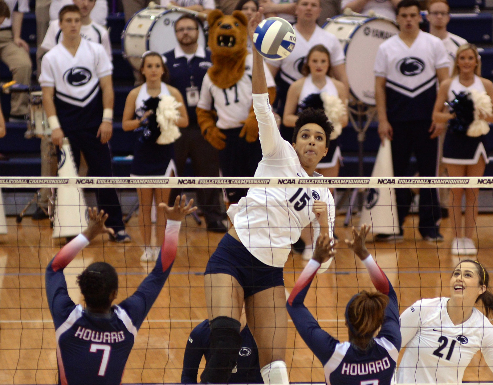 Penn State middle hitter Haleigh Washington attacks from the middle (Al Case)