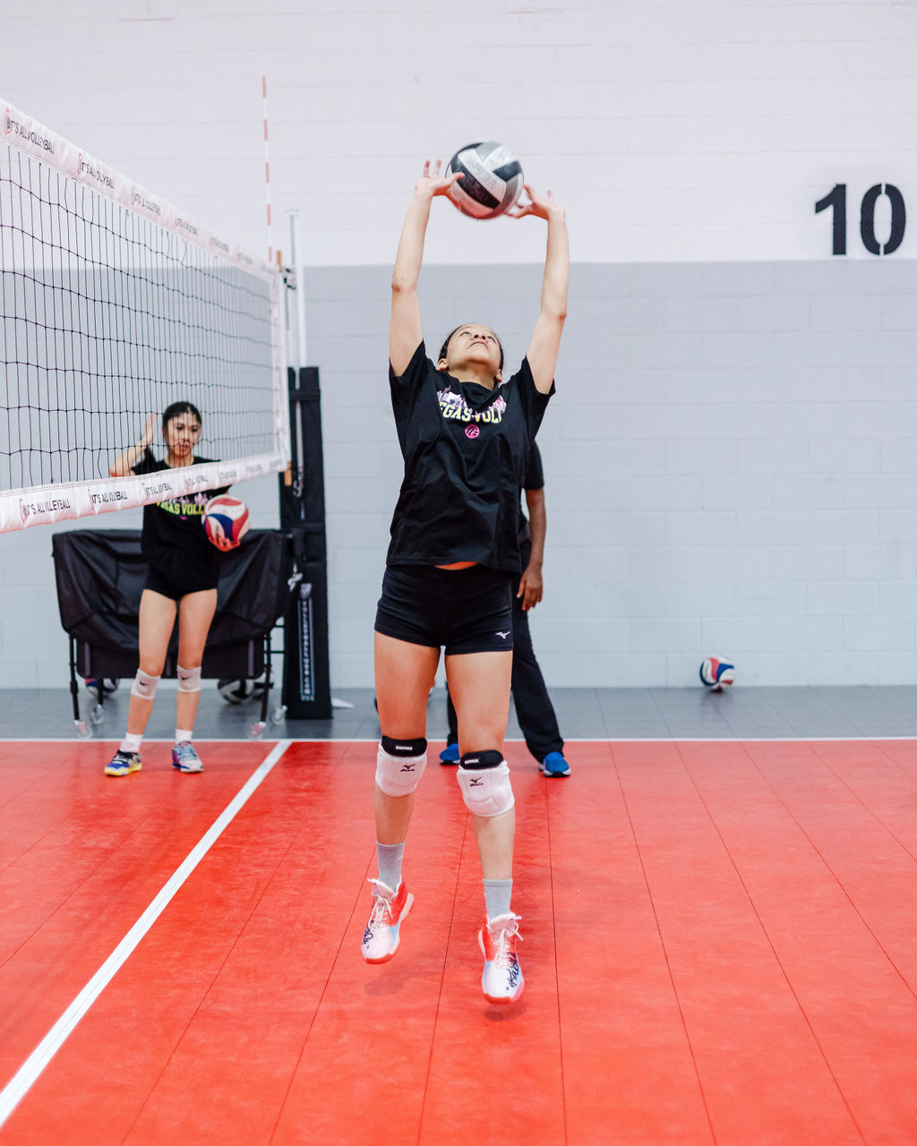 How To Set To Your Opposite Hitter? To set the ball behind you to your right side hitter or deliver any balls to zone 2 you will do so by back setting the ball back over your head. (Shots by Shanty)