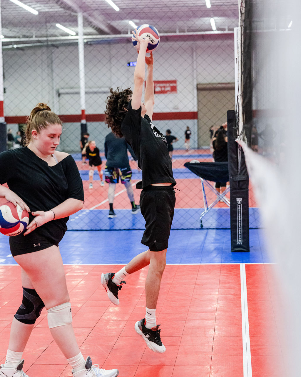 Setting in Volleyball: If the setter can make the opposing middle  think they're going to set middle, then the middle blocker has to stay and block the middle. 
Watch Sergio, my Vegas Volley 18s setter, side setting during practice.