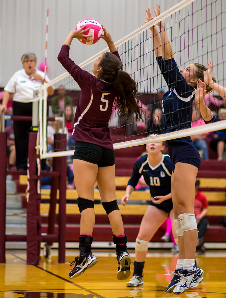 Court Volleyball Positions: The setter's job is to outsmart the opposing team's block so her hitters hit the ball with the least number of opposing blockers trying to block their attack hits. (Ralph Aversen)