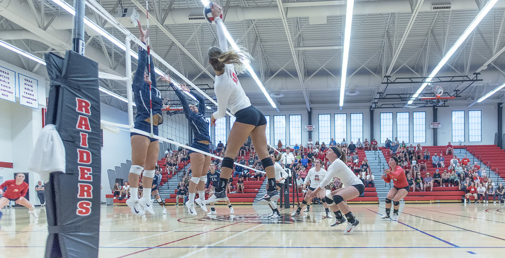 The outside hitters use their speed combined with their high vertical jumping ability to score points against the defense. (Al Case)