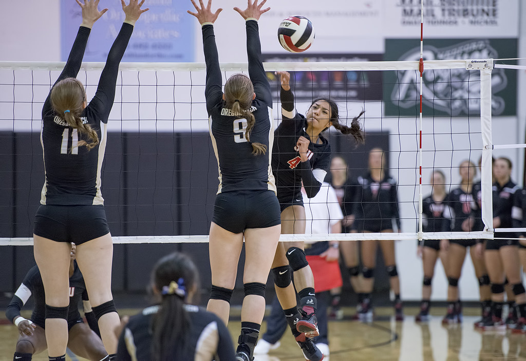 The spike definition volleyball terms describe 4 ways to hit a ball including a cross court shot, hitting a line or cross court shot, or using the cut shot. 