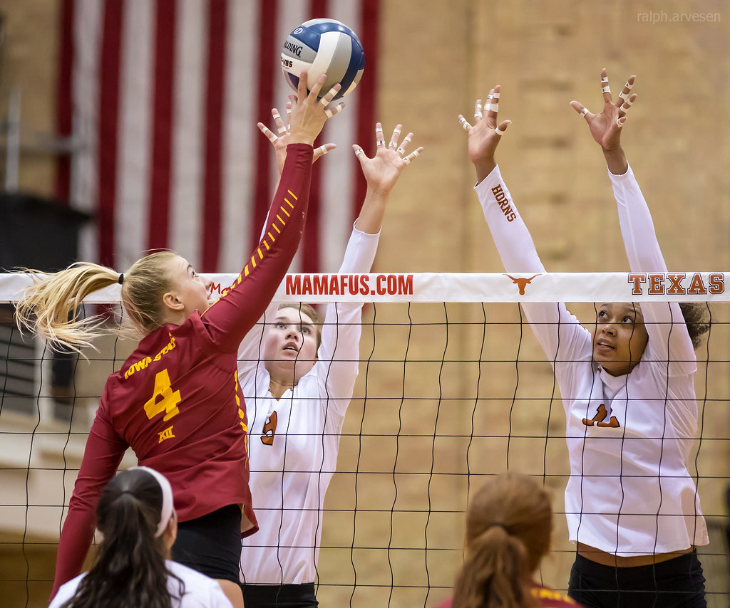 Volleyball Blocking Tips: Texas Longhorns blockers watch the hitter. When blocking 1.watch the ball then the setter, back to the ball finally the hitter as they contact the ball. (R. Arvesen)