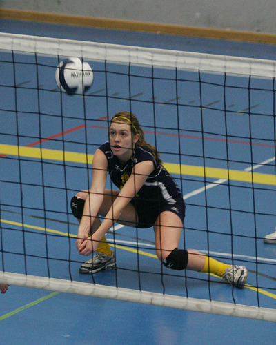 If you're on your high school volleyball varsity team these six skills you need to do well to make the starting team: set, pass, block, dig, serve, and hit.

high school varsity volleyball girl passing a ball photo by herald post1