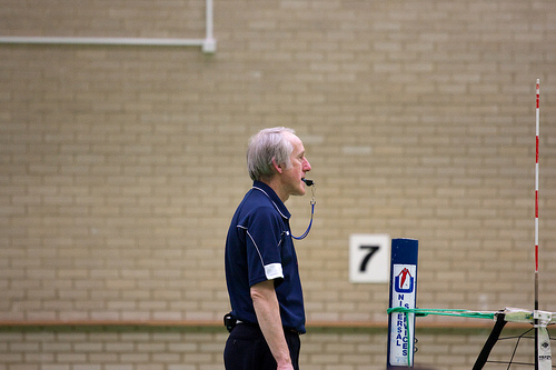 Volleyball officials: The first referee watches the blockers for net touches, calls the double hits, lifts, technical fouls, timeouts and starts each play with a whistle blow to each server.