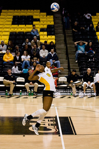 Dimensions of a Volleyball Court: Player Serving Behind The White Service Line (photo Henry Stern)