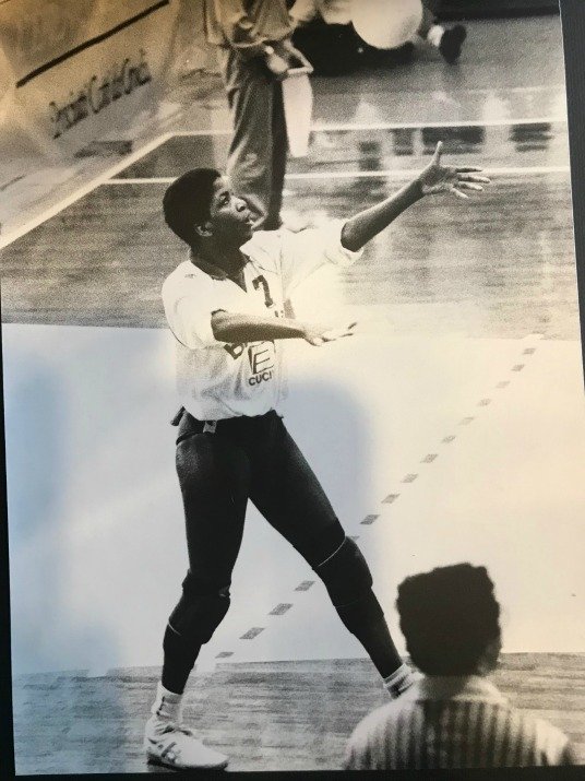 The volleyball toss for the overhand serve needs to consistently be two feet up in the air and one foot in front of your front foot in the path of your serving arm.