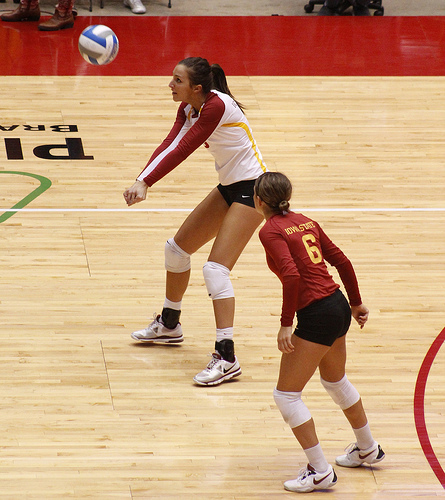 Volleyball Bump Pass Technique: Creating a Flat Platform for Contact: Keep hands and wrists pressed together with the fist of one hand inside the other hand while thumbs of both hands point down to the ground. (Matt van Winkle)