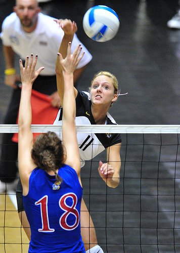 Spike Volleyball Definition: A kill can be a spike or a tip that gets past the block and hits the floor. You're credited with a 'kill' if you score a point with a tip.  (Wunderlich Photography)