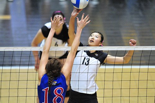 Middle Blocker Training For Players On Defense at the Net: 
Big 12 Missouri Tigers middle blocker tipping over opposing blocker by wunderlich photography