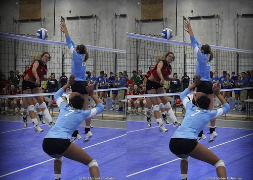 Double Block Volleyball Techniques: Some blockers jump "up" in one spot and come "down" in another one that's quite far from where they took off. (Johnston photo)