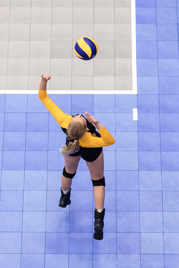 Serving Volleyball Drills For Beginners: I dedicated this page to providing beginner-level serving drills that will help you kickstart your journey towards becoming a super strong confident server. 
(photo by Matt Duboff girl jump float serve)