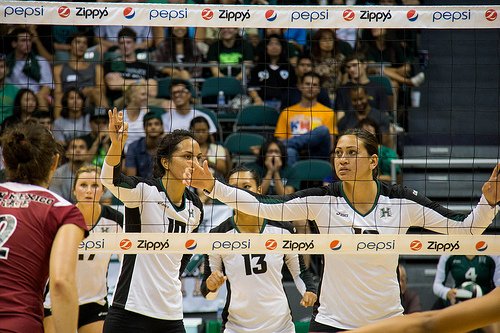 Front row players communicate in volleyball. They call out which hitters on the opposing team are in the front row, where the setter is and which backrow hitters could possible be getting a set.