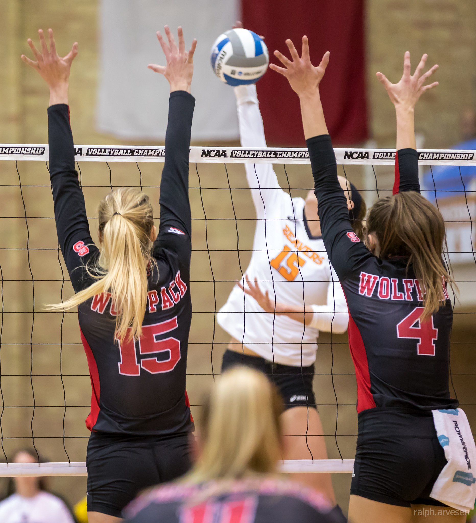 Blocker in Volleyball: 4 Things You Can't Do When Blocking On The Net.  North Carolina blockers at the net against an Oregon State attacker.