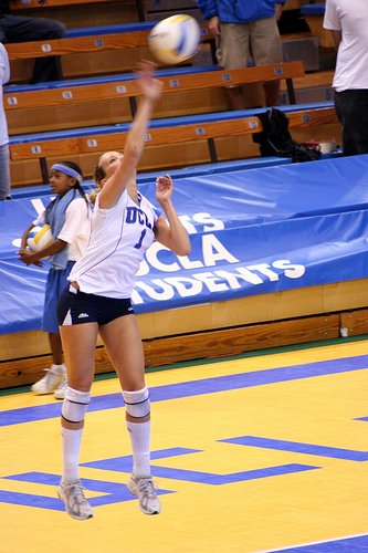 Overhand Serve Volleyball Techniques: Every movement functions to get the ball aggressively over the net in a way that makes it difficult for the opposing team to receive serve.   (JMR Photography)