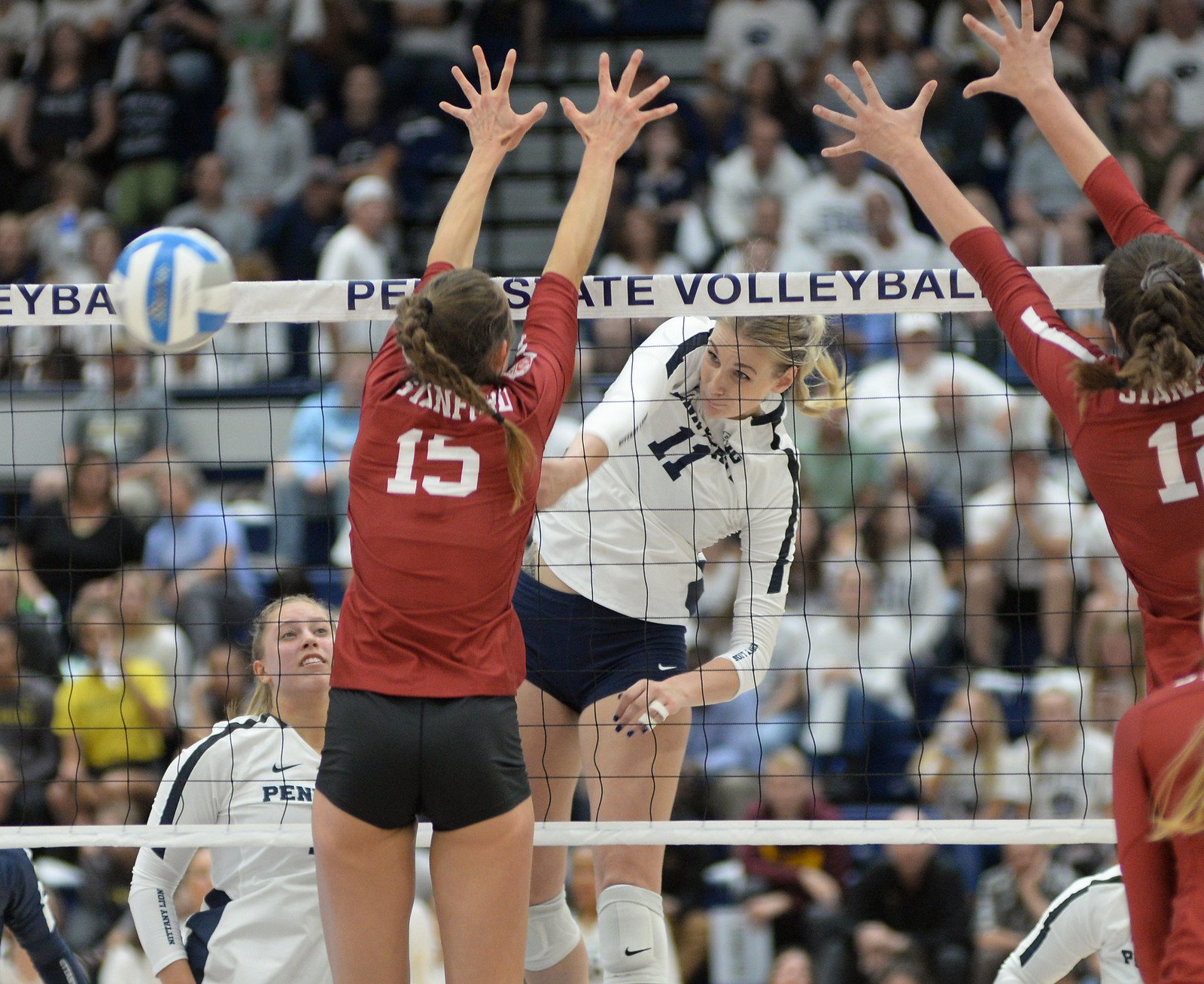 Middle Blocker in Volleyball Upper Body Technique: Stanford blockers hands face the middle of the opposing court so ball deflects back to the middle of the court. (Penn State News)