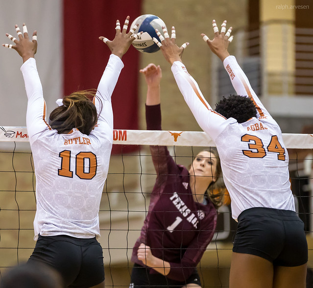 A seam refers to the opening or space created between the two blockers at the height of their block jump.

Smart hitters aim their spike for the seam so the ball can pass between the blocker's arms in order to exploit the space and score points.
(Texas AandM outside hitter hits high seam against the double Texas block photo by Aversen)