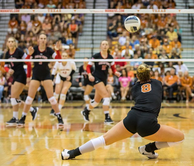 If you're the receiver, also known as the passer in practice or private training you learn

-how to step into the path of the oncoming served ball
-while clasping your wrists of both arms together to create a "platform"
-used to contact the bottom third of a volleyball ball to redirect it in the air towards a player, usually the setter who's made their way to the net.

Texas libero passing Texas Tech (Ralph Aversen)