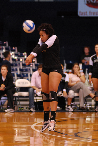 In serve receive, pass with both feet on the court floor rather than doing the "jump-bump." You can make small adjustments with your feet on the ground which you can't do with your feet in the air.