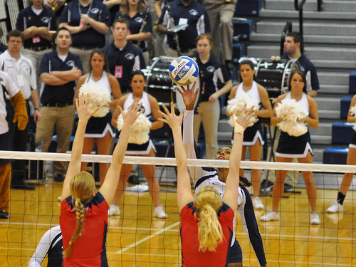 How To Block Volleyball Players: Penn State Volleyball Player Tipping Over A Double Block (Photo by John O'Brien)