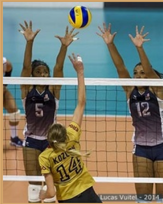 Ebony Nwanebu blocking with Rachael Adams Texas Longhorn teammates on the USA National Team (photo provided by brvc)