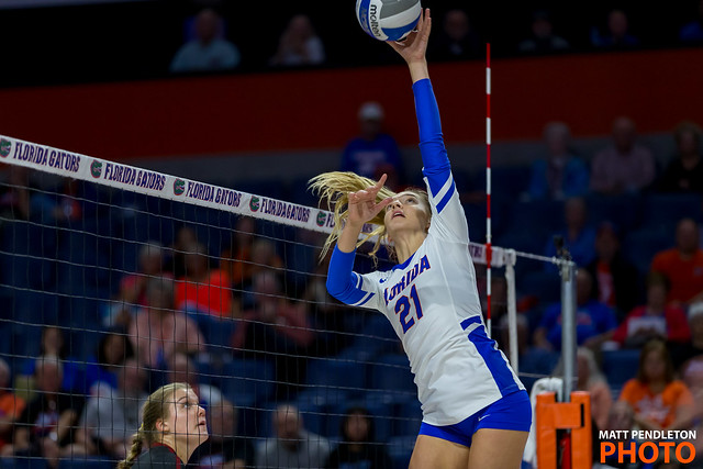 "Be a student of the game. Study opponents' tendencies and adapt your setting strategies accordingly."
Learn from the Best: Top Inspirational Quotes For Volleyball Setters

- Coach Michelle, University of Florida
Florida gator setter dump attempt while blocker watches ready to jump (matt pendleton photo)