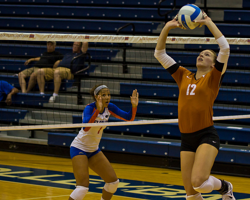 Of course your hands are above your head but your midsection should be positioned so its facing left front. 
-University of Texas volleyball setter (photo by Gallery Three)