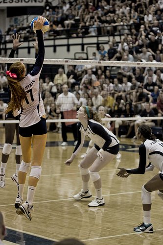 Smart hitters look for volleyball tipping opportunities to outsmart the opposing team's defense. After you've hit a few balls hard on the next good set tip the ball to an open space. (Gallery Three)