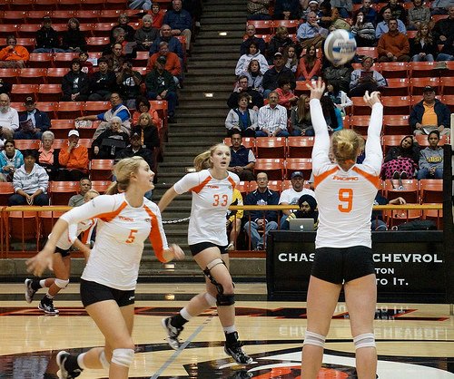 All the hitters will hit a particular set, depending on which "play" the setter calls. The UOP volleyball setter calls a back set and a front set in this photo. (photo Inky Hack)