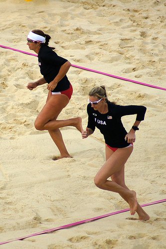 Volleyball Trivia Quizzes Answers Questions For Volleyball Players: 
Misty May-Treanor and Kerri Walsh Jennings

This dynamic duo formed one of the greatest partnerships in beach volleyball history.

With exceptional teamwork and unparalleled success, they won multiple Olympic gold medals and dominated the sport throughout the 2000s.
(photo of Kerri and Misty Olympics 2012 warmup by Daniel Coomber)