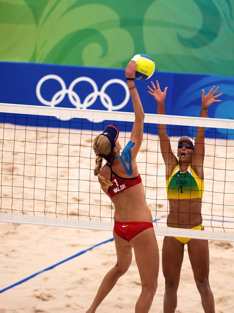 Since its debut as an official Olympic sport at the Atlanta 1996 Games, the Olympic beach volleyball evolution has included some notable changes, adaptations, and developments within the Olympic context.


Kerri Walsh spiking in the 2012 Olympics (photo by maccubbin)