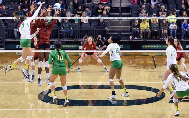 Four Types of Volleyball Blocks Varsity Volleyball Players Should Know: Oregon outside hitter attacks the ball against a double block. (Al Case)