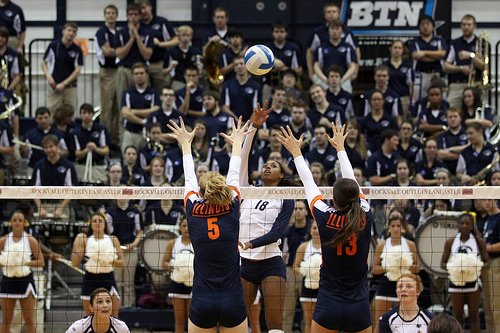 Penn State Volleyball Player Tipping Over The Illinois Blockers photo by Richard Yuan