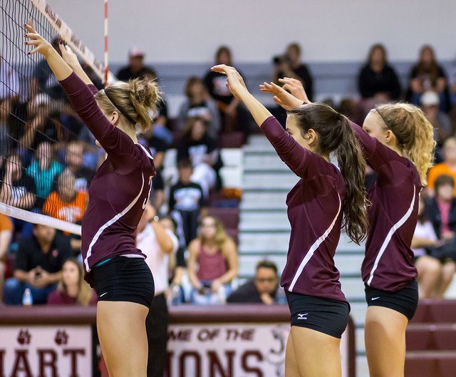 What's the block in volleyball?  Varsity blockers with hands way above their heads (Ralph Arvesen)