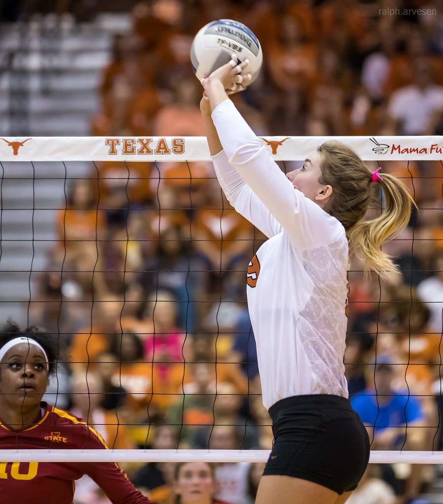 The Middle Blocker Position in Volleyball: Iowa State middle blocker watches the Texas Longhorns setter just as she sets the ball to one of her hitters (Ralph Arvesen)
