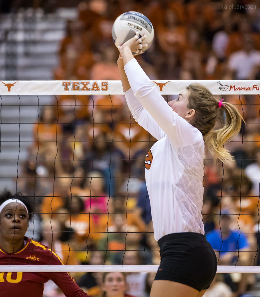 Volleyball Blocking Tips: As the opposing team sets the ball, you as a blocker, want to watch the setter as she sets the ball to her hitter. (Ralph Arvesen photo)