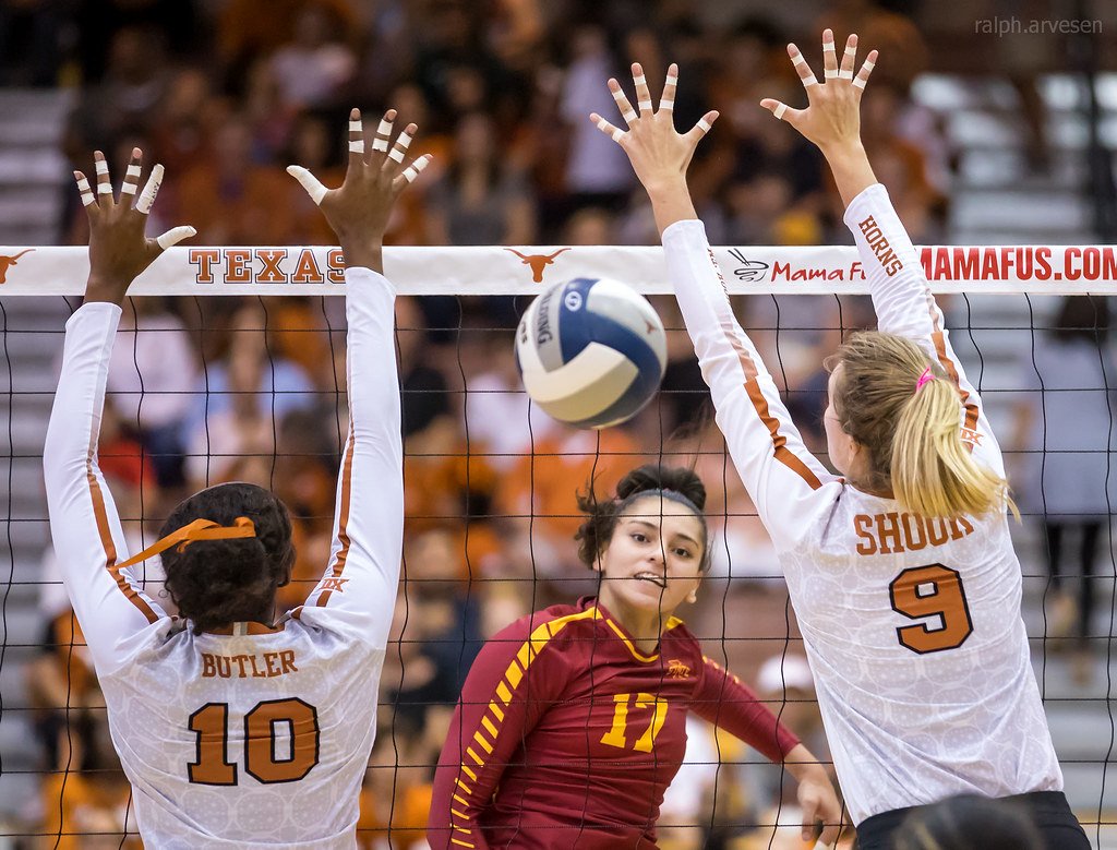 How to Set in Volleyball: Texas middle blocker Brionne Butler is late getting to the outside to close the block with setter Ashley Shook. (Ralph Arvesen)