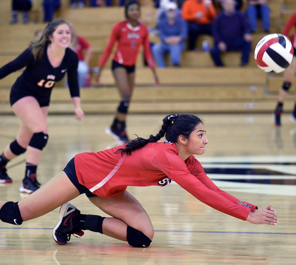 Defensive Specialist in Volleyball: Keep an attacked ball off your court floor by extending your arms and hands under the ball to deflect it back in the air before it hits the floor. 
(Al Case)