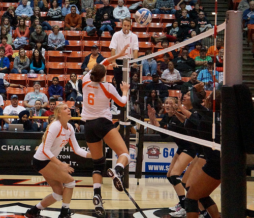 A left handed setter tip the ball faster but she's in a better position to dump the ball over the head of the opposing left front blocker