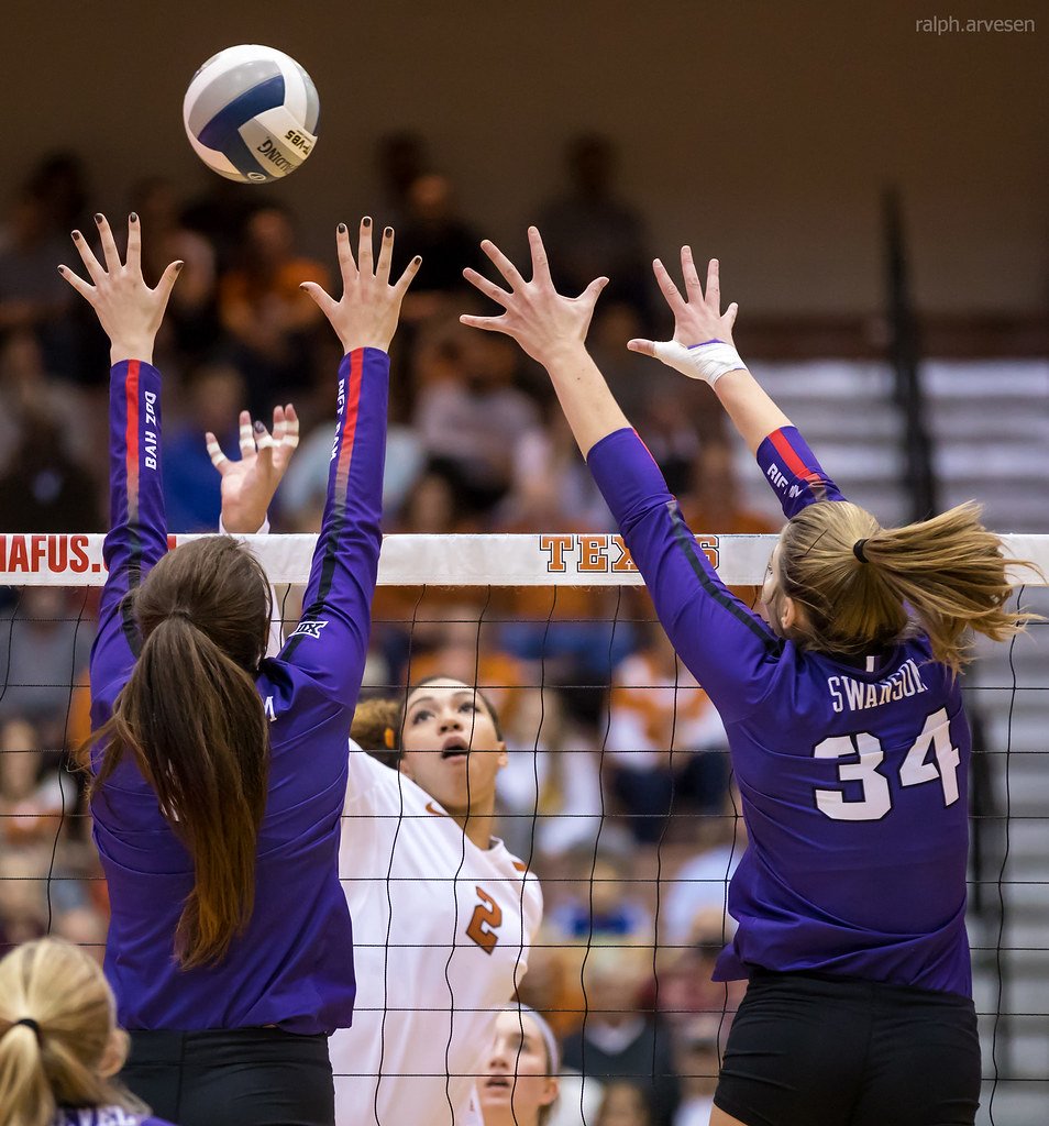 Savvy hitters when they hit or tip the ball into the blockers hands, the ball will bounce back outside of the sidelines, scoring their team a point or a sideout. (Ralph Arvesen)